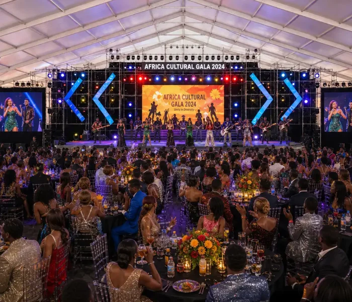 Interior of an aluminum alloy clear span tent set up for a large gala dinner.